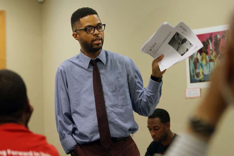 Sean Brown talks at a meeting of the Camden Leadership Alliance in 2015 about his petition drive to shift the city's school board from an appointed to an elected body.