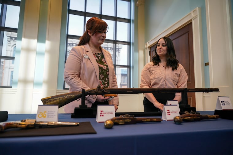 Rachel Warner (left) and Emily Immel of the York Historical Society at an event announcing the return of stolen artifacts held at the Museum of the American Revolution on Friday.