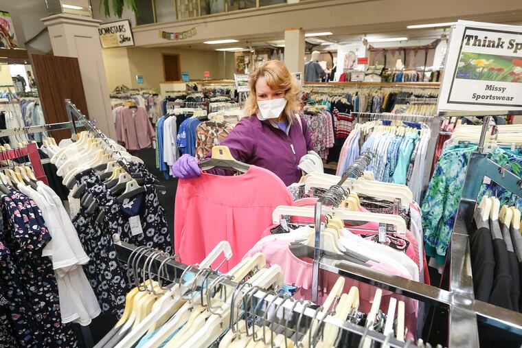 Beth Scheiderman from Mansfield shopping at Dunham's Department Store in Wellsboro, Tioga County, on its first day back open on May 8.