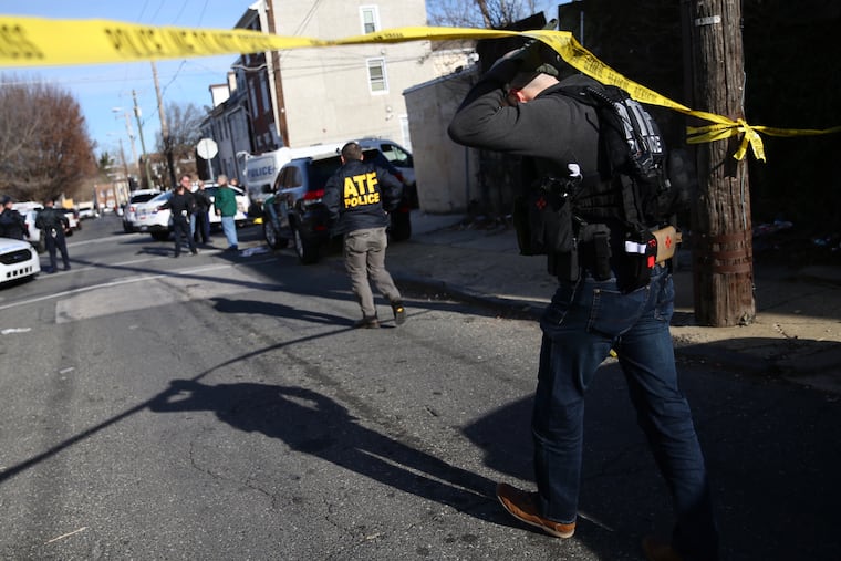 An ATF agent arrives on the scene of a reported shooting in the 4600 block of Hawthorne in Frankford on Thursday, Jan. 9, 2020.