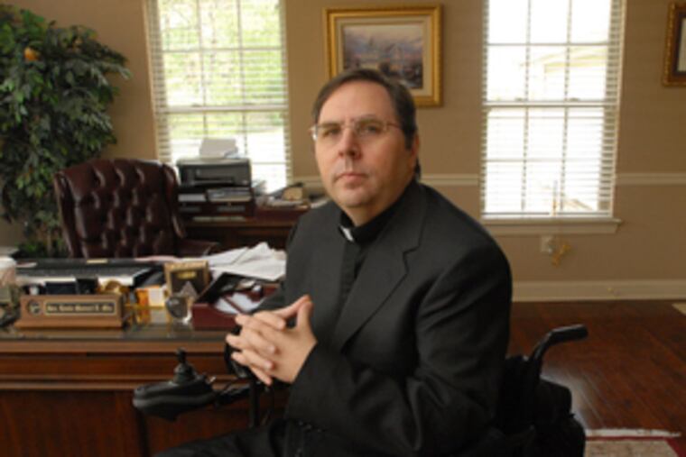 Msgr. Louis Marucci at St. Vincent Pallotti Church, which might be merged with one that is not wheelchair-accessible.