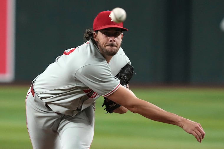 Philadelphia Phillies pitcher Aaron Nola throws against the Arizona Diamondbacks in the first inning of a baseball game, Saturday, Sept. 20, 2025, in Phoenix. (AP Photo/Rick Scuteri)