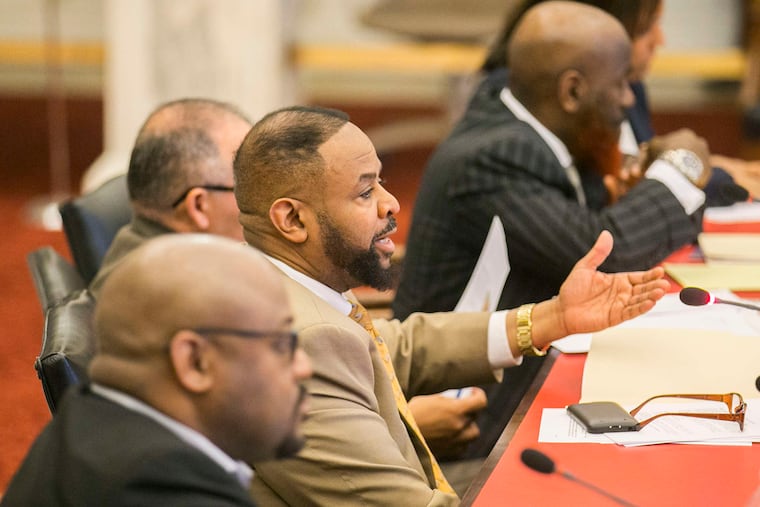 Councilman Curtis Jones, Jr., center