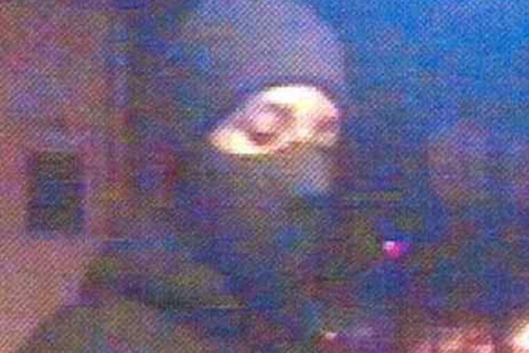 ATM photos of the two men who are being sought in the robberies, the latest of which was Thursday.