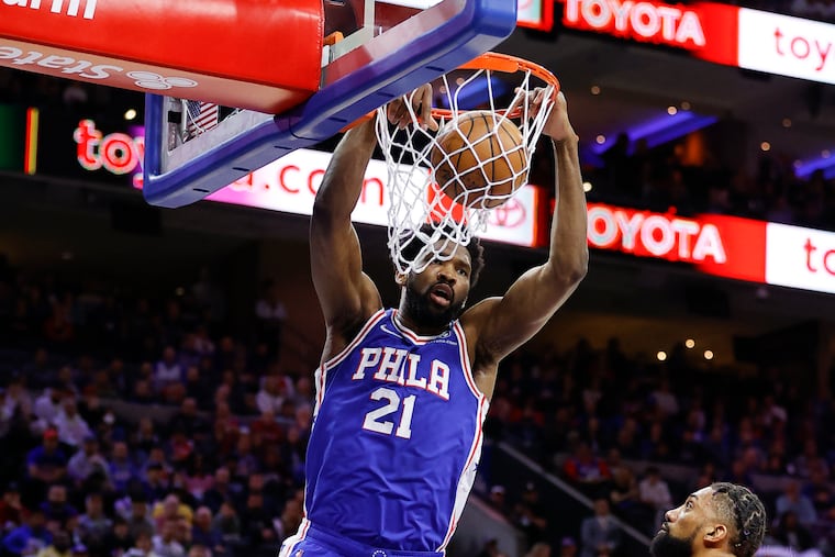 Sixers center Joel Embiid dunks the basketball past Toronto Raptors center Khem Birch in the first quarter during Game 5.