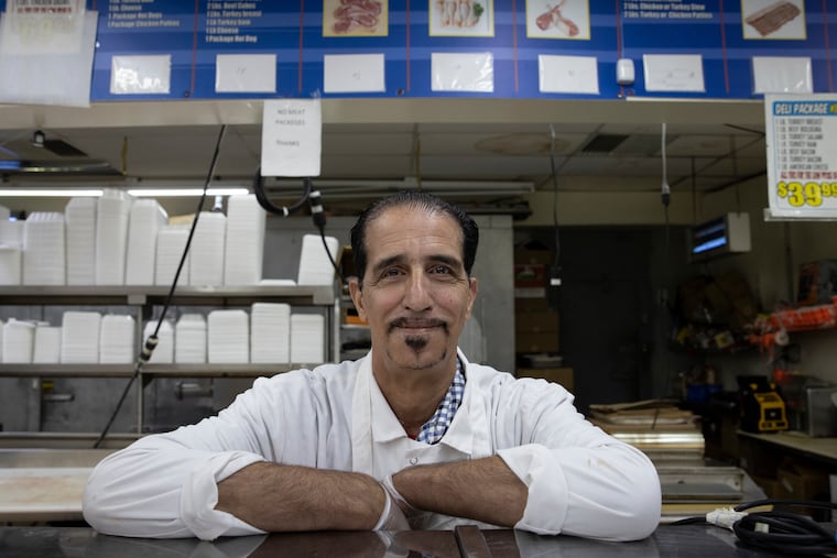 Emad Oweis, 60, an immigrant from Palestine, is a butcher at Al-Aqsa Supermarket. He said that while life has improved, Muslims still face prejudice in the United States by people who blame them for Sept. 11: “Even if we live like angels, some still call us heathens," he said.