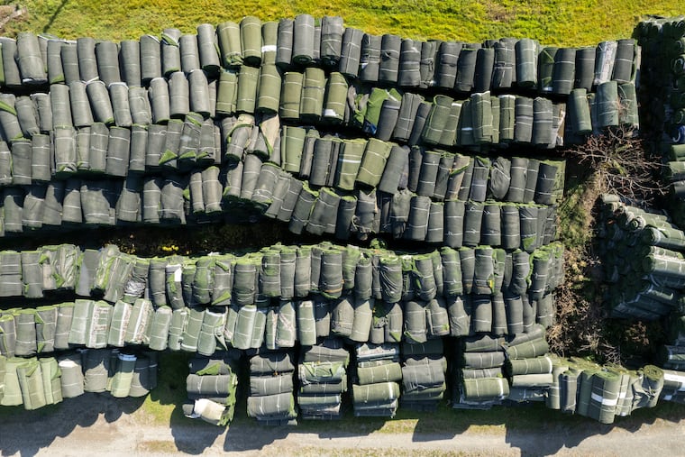 Almost 6,000 rolls of artificial turf sit on the farm of the late Benedict Diaz in Nicholson, Pa. Re-Match, a now-bankrupt recycling firm, has left them here. Now the state's Department of Environmental Protection has to figure out how to dispose of it.