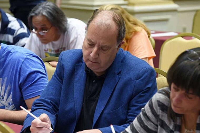 Dalily News Reporter, Chuck Darrow, in blue sport coat, answers test questions for Who Wants To Be A Millionaire, at Trump Taj Mahal Hotel Casino, Atlantic City, NJ on May 31, 2014. (Photo By Gregg Kohl)