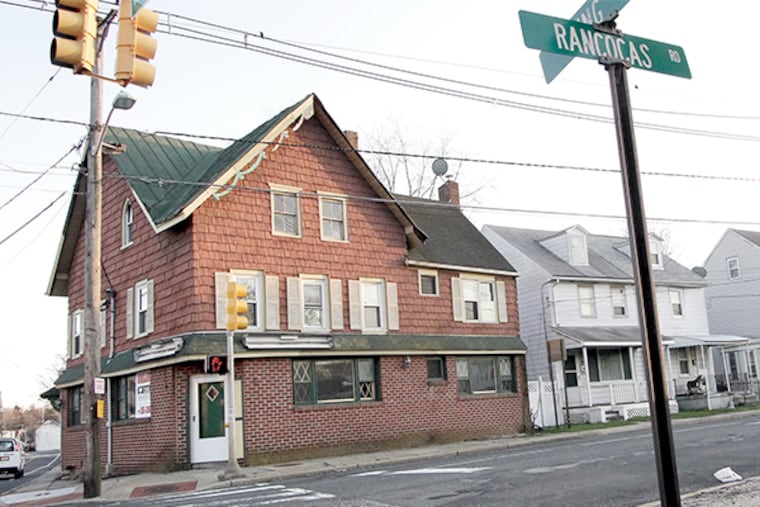 Its out of business for Buzz's Tavern (left). Linda and Rick Ford own the home to the right of the closed tavern. The Mount Holly council voted 3-1 Monday to create a redevelopment zone after listening to the concerns expressed by about a dozen residents and shop owners who worry their properties may be seized through eminent domain.