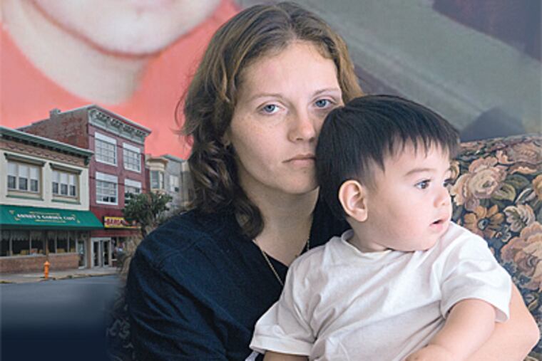Luis Eduardo Ramirez Zavala, an illegal immigration, was slain in July. Fiancee Crystal Dillman sits with their son, Eduardo. (Jessica A. Griffin / Daily News)