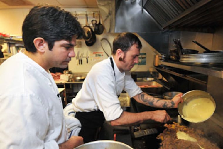 Luke Palladino assists his executive chef, Ed Affinito, in Palladino's Northfield, N.J., restaurant. (Gregg Kohl)