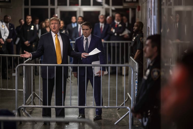 Donald Trump, then the former president who was charged with falsifying 34 business records in an attempt to cover up a payment to adult film actor Stormy Daniels, speaks to reporters alongside his attorney Todd Blanche, right, during his trial at Manhattan Criminal Court on May 21, 2024. Key Republicans on the Judiciary Committee could push for concessions from Blanche, now in line to be attorney general, though they did not appear in revolt.