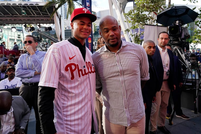 Justin Crawford (left) with his father, former All-Star outfielder Carl Crawford in 2022 when the Phillies made Justin the 17th pick of the draft.
