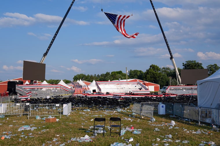 The campaign rally site for Republican presidential candidate former President Donald Trump is empty and littered with debris Saturday hours after a gunman injured Trump and killed a bystander.
