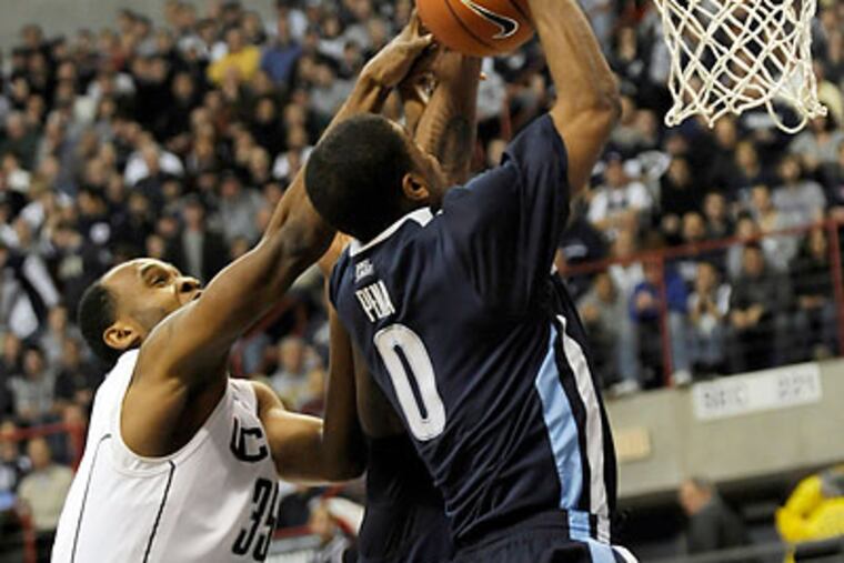 Connecticut put the clamps down on Villanova defensively for much of the game. (Bob Child/AP)