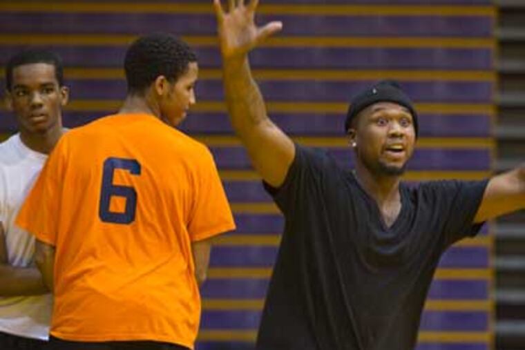 Former Camden boys basketball player Dajuan Wagner came back to help the team during practice. (David M Warren/Staff Photographer)