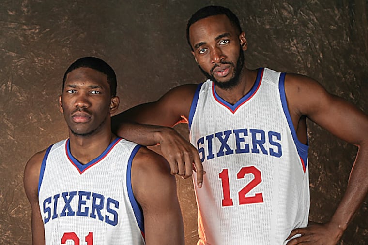 The 76ers' Joel Embiid and Luc Mbah a Moute. (Steven M. Falk/Staff Photographer)
