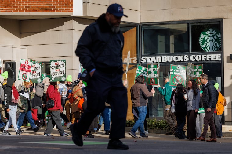 Starbucks workers strike on the company's Red Cup Day in Philadelphia on Thursday.