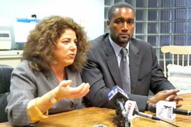 Albert Florence and his attorney, Susan Chana Lask, sit in a law office in Newark. (Joelle Farrell / Staff)