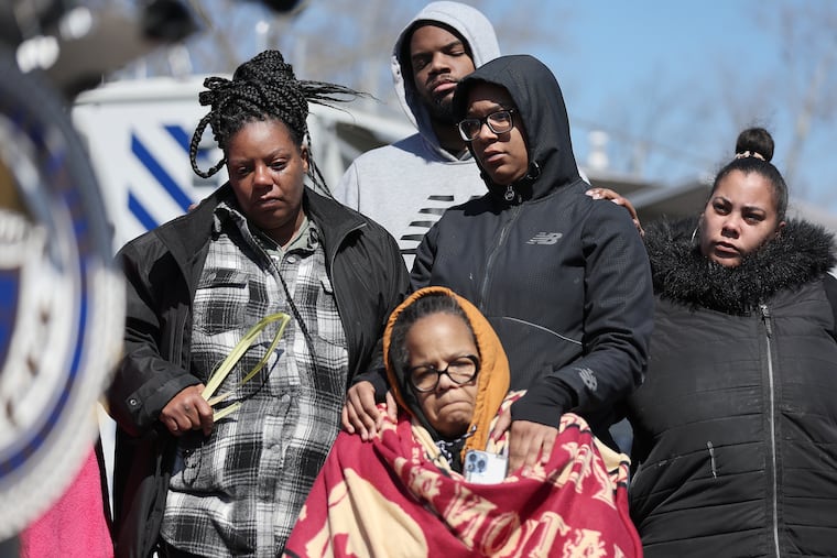 Relatives of the missing 6-year-old girl who fell into Chester Creek listen during a news conference Sunday. John-Paul Shirley, Chester Fire Department battalion chief, said the search was switching to a recovery effort.