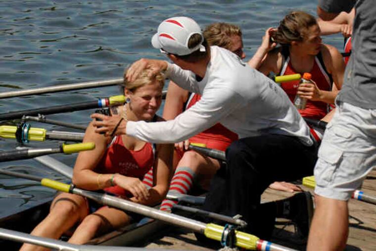 Haddon Township coach Scott Wisniewski gives rower Tori King a pat on the head after she and the rest of the girls' junior quad team took third place behind Conestoga and Friends Academy during the Stotesbury Regatta on the Schuylkill.