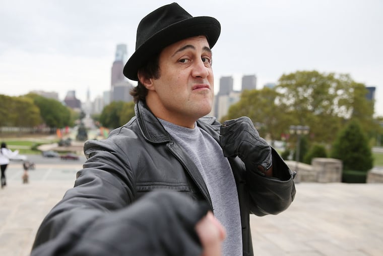 Mike Kunda, a "Rocky" tour guide and impersonator, gives tours in Philadelphia on October 7, 2014. ( DAVID MAIALETTI / Staff Photographer )