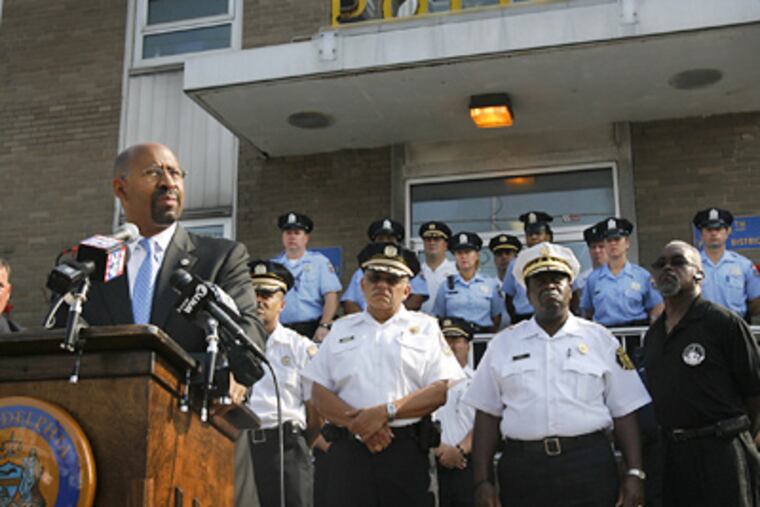 Mayor Michael Nutter, accompanied by Philadelphia Police Commissioner Charles Ramsey and Fire Commissioner Lloyd Ayers, speaks about possible police and fire layoffs during today's press conference. (Alejandro A. Alvarez/ Staff Photographer)