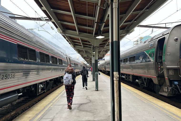 FILE - People walk through Union Station on March 27, 2026, in Washington. (AP Photo/Bill Barrow, File)