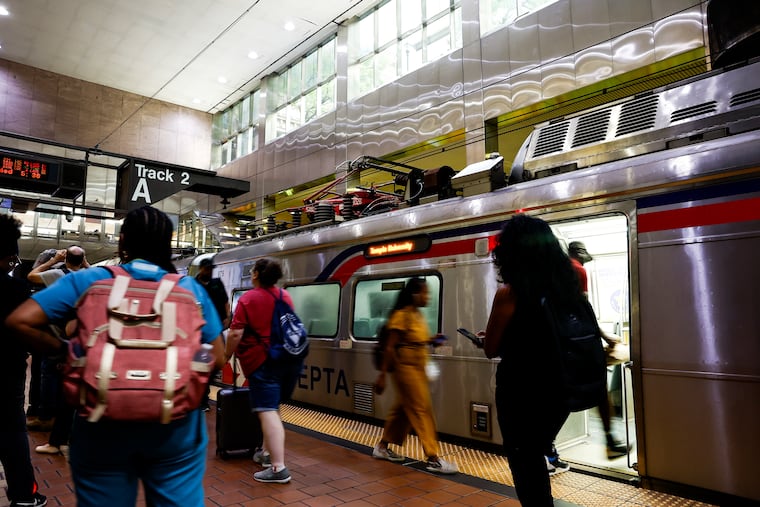 People board a train during the evening rush hour at Jefferson Station on Wednesday, Aug. 13, 2025 in Philadelphia, Pa.