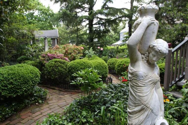 In the backyard , the English garden is lush and relaxing and butterfly-friendly.