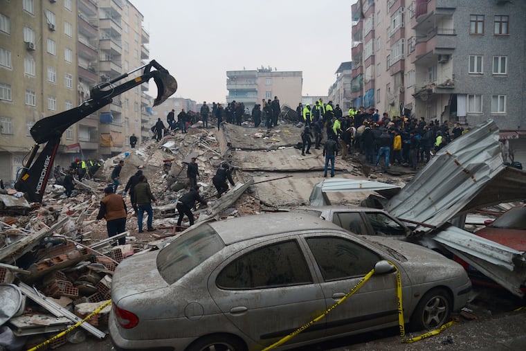 People search for survivors in Diyarbakir, on February 6, 2023, after a powerful earthquake struck the country's south-east. It is one of Turkey's biggest quakes in at least a century. (Ilyas Akengin/AFP via Getty Images/TNS)