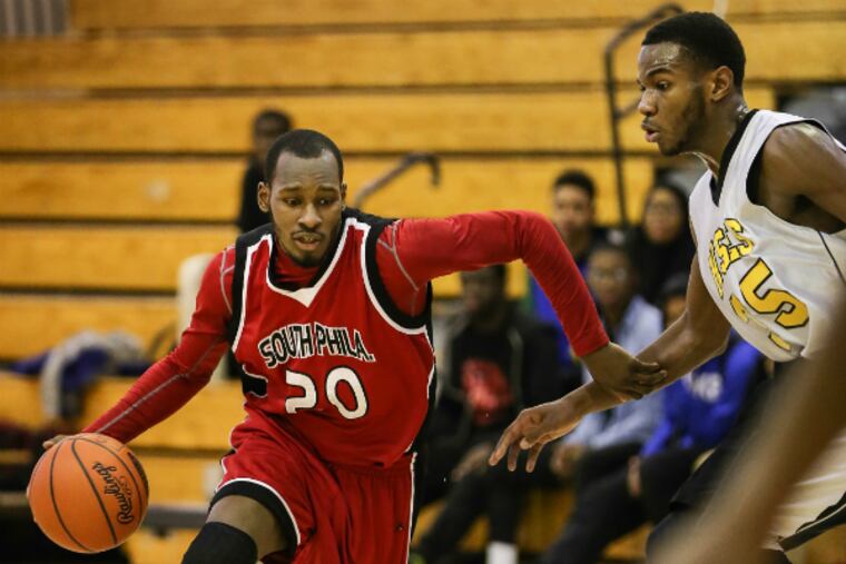 Southern’s La’Trelle Wilson drives on E&S’s Johnathan Hall in second quarter.