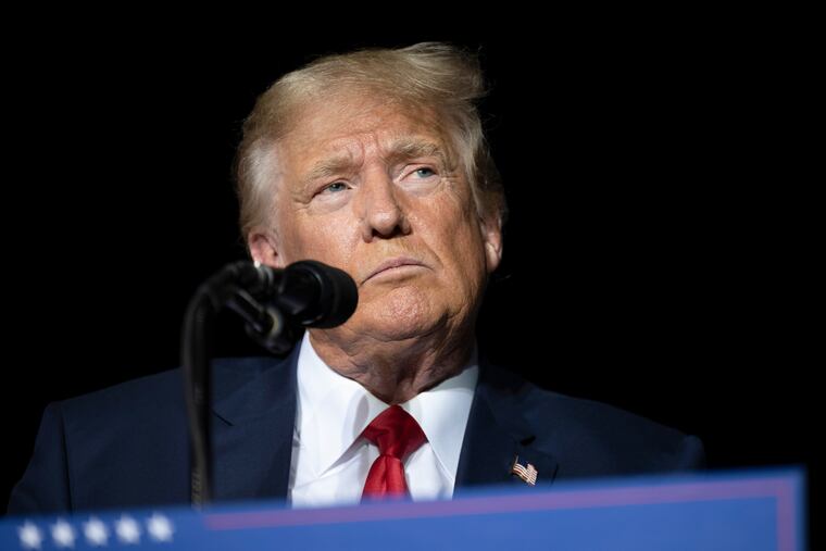 Former President Donald Trump pauses while speaking at a rally at the Minden Tahoe Airport in Minden, Nev., earlier this month.