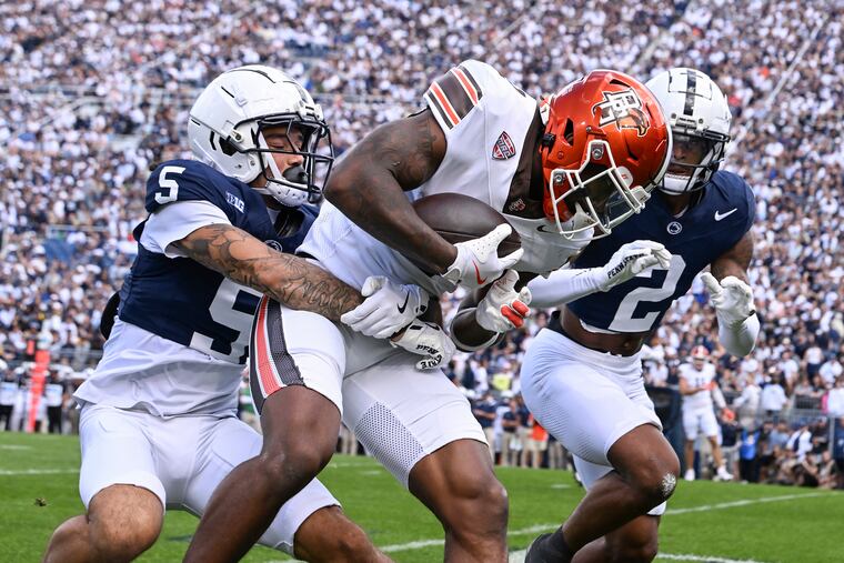 Penn State cornerback Cam Miller wraps up Bowling Green wide receiver Malcolm Johnson Jr. during the first quarter Saturday.