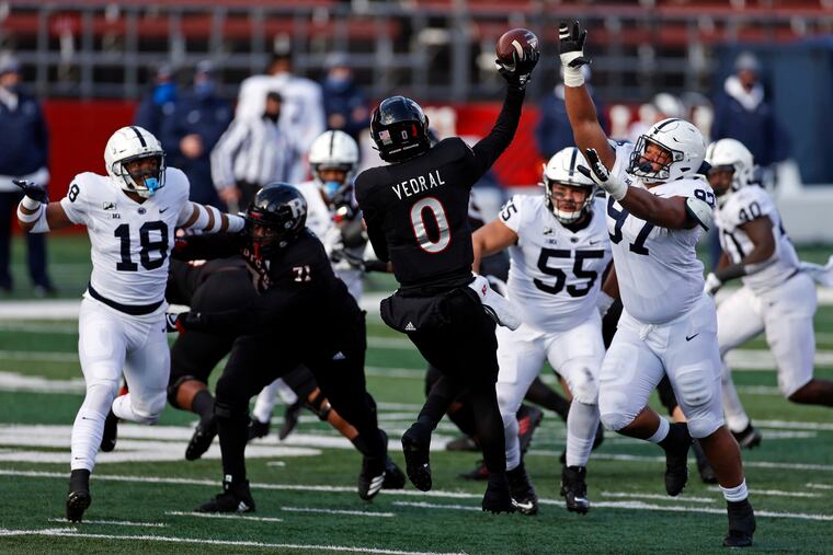 Penn State defensive tackle PJ Mustipher (97) pressures Rutgers quarterback Noah Vedral (0) during the second half of an NCAA college football game Saturday, Dec. 5, 2020, in Piscataway, N.J. (AP Photo/Adam Hunger)