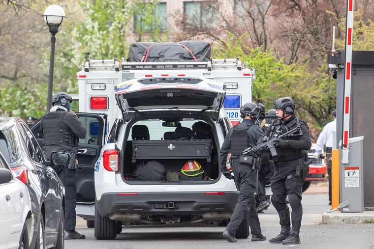 A S.W.A.T team prepares during a barricade situation in connection with the abduction of a toddler at a hotel near the Philadelphia International Airport on April 12.