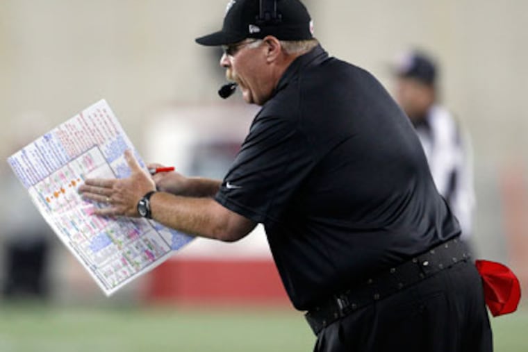 Eagles coach Andy Reid claps for his defense in the first quarter against the Patriots. (Yong Kim/Staff Photographer)
