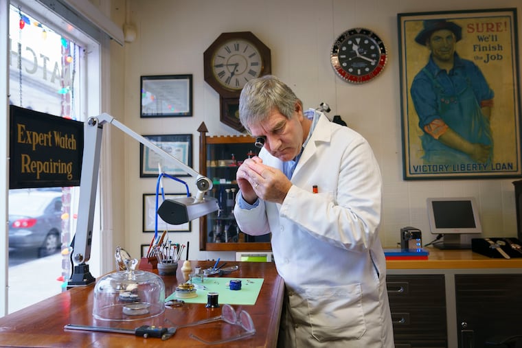 Owner and watch repairman Peter Whittle shown here working at Whittle's Watch Works, in Wayne, on Dec. 16, 2019. Over the years, as the number of watch and clock repairmen declined, his business has increased. He now has so many customers that he often has to close his shop to catch up.