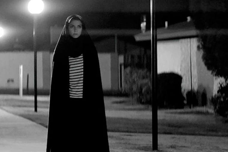 Sheila Vand is a vampire in a chador who meets a James Dean-type guy amid sordid denizens in "A Girl Walks Home Alone at Night." (Kino Lorber)