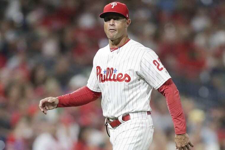 Phillies manager Gabe Kapler walks back to the dugout after a pitching change against the Marlins on Friday.
