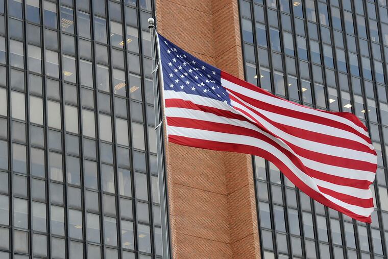 The American flag waves at the James A. Byrne United States Courthouse, Tuesday, Nov. 3, 2020, in Philadelphia.