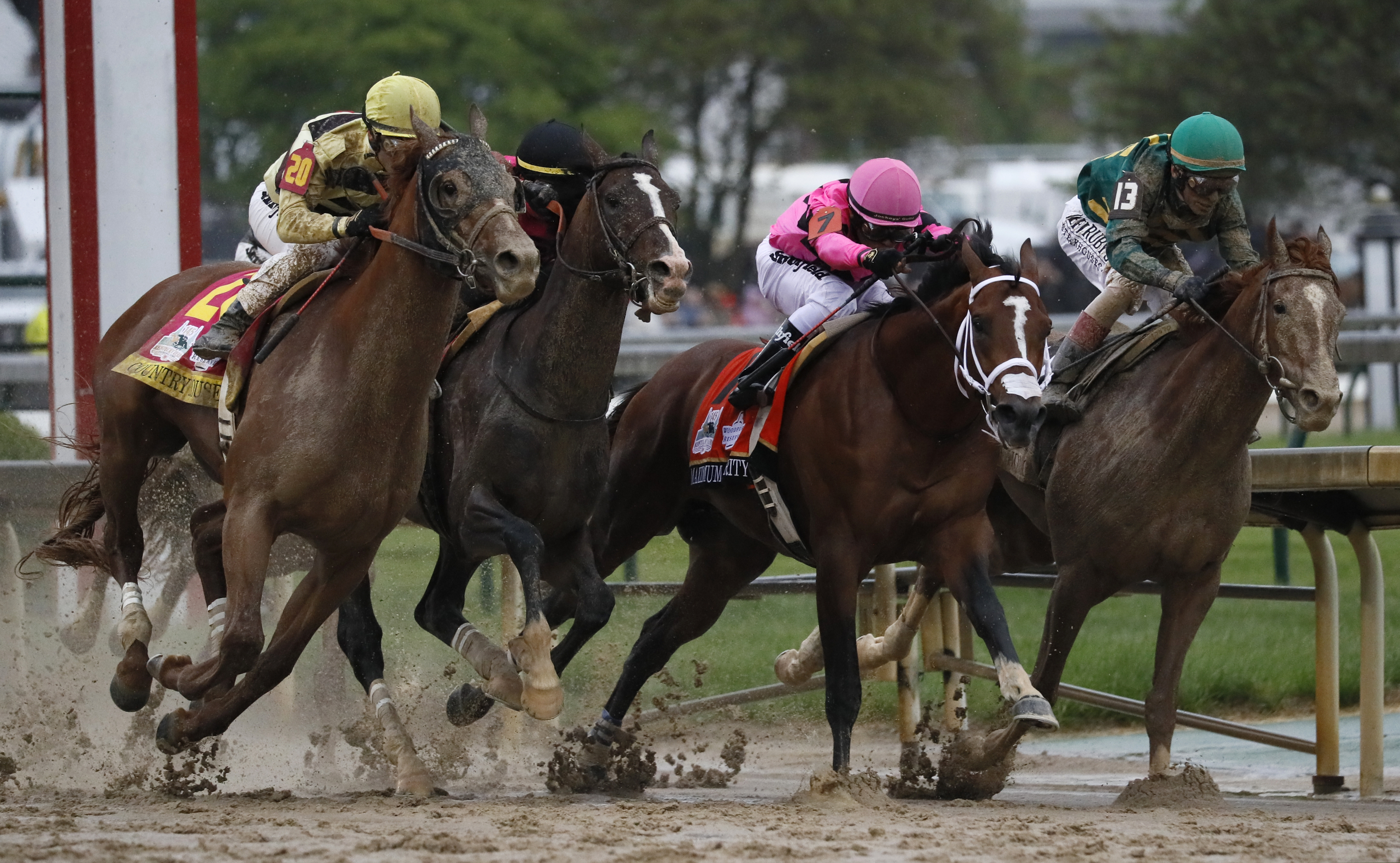 Flavien Prat on Country House, left, races against Luis Saez on Maximum Security, second from right, during the 145th running of the Kentucky Derby horse race at Churchill Downs Saturday, May 4, 2019, in Louisville, Ky. Maximum Security was disqualified and Country House won the race.