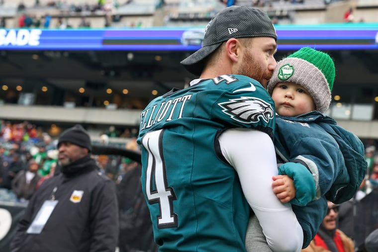 Philadelphia Eagles place kicker Jake Elliott and his baby before the NFC championship game against the Washington Commanders on Sunday, Jan. 26, 2025, in Philadelphia.