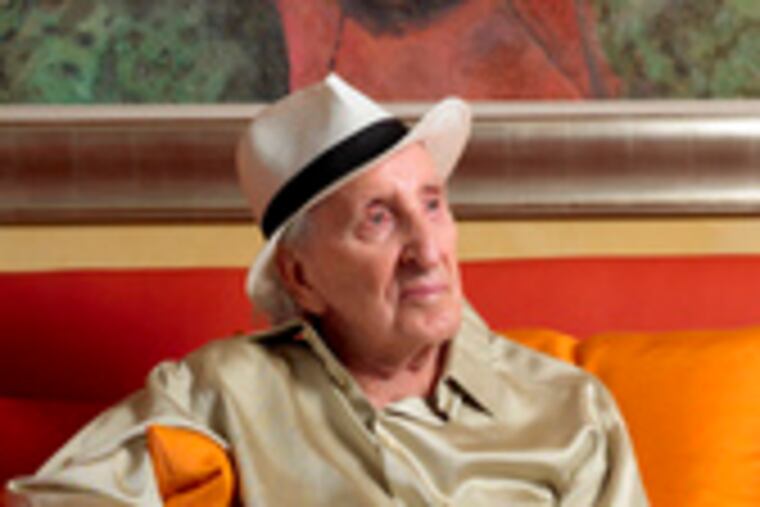 Jack L. Wolgin at his Florida home with a painting by the late Mexican artist Rufino Tamayo. The work is part of Wolgin's collection.