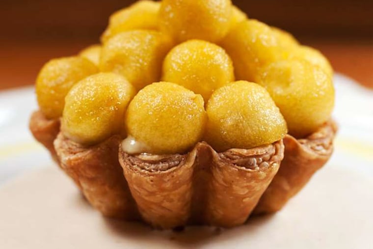 The saffron-poached apple balls are elegant yet accessible dessert served at Fond bistro in East Passyunk.