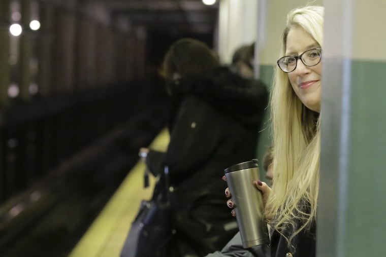Ellen Keiffer of Bensalem waits for her evening rush hour Regional Rail train from Suburban Station to Cornwells Heights.
