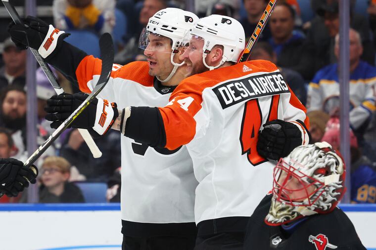 Flyers right wing Garnet Hathaway celebrates after his goal with left wing Nicolas Deslauriers during the second period Friday against the Buffalo Sabres.