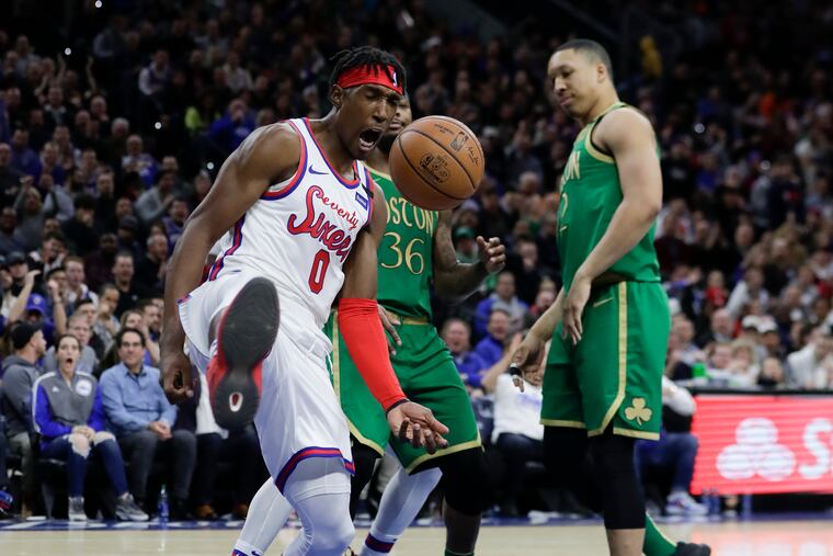 Sixers guard Josh Richardson celebrates his fourth-quarter dunk against Boston Celtics forward Grant Williams (right) and guard Marcus Smart.