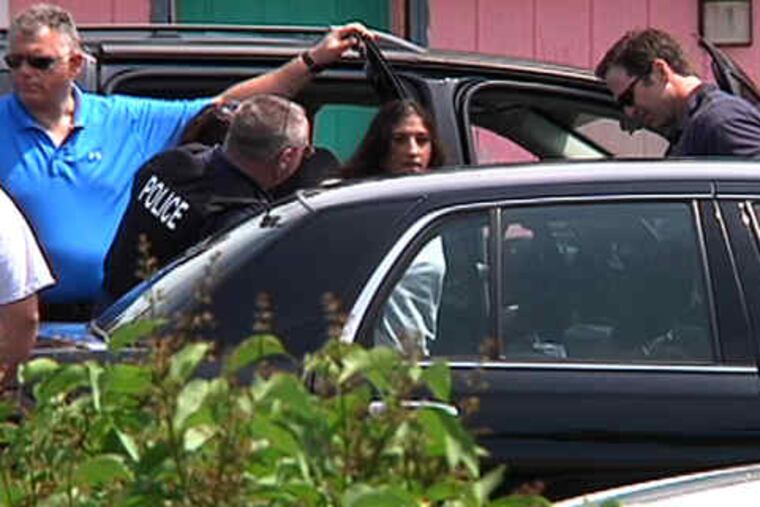 "Good police work" led investigators to the Golden Key Motel in Egg Harbor Township, Atlantic County, Prosecutor Ted Housel said. Above, footage from video shows police putting Jessica Kisby into a vehicle outside the motel. Below, career criminal Craig Arno sits in handcuffs.