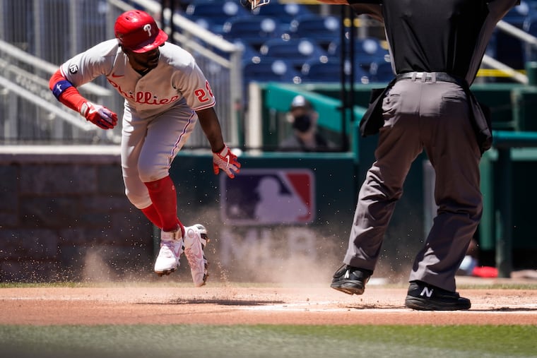 Andrew McCutchen celebrates after stealing home in the first inning of the Phillies' loss to the Nationals.